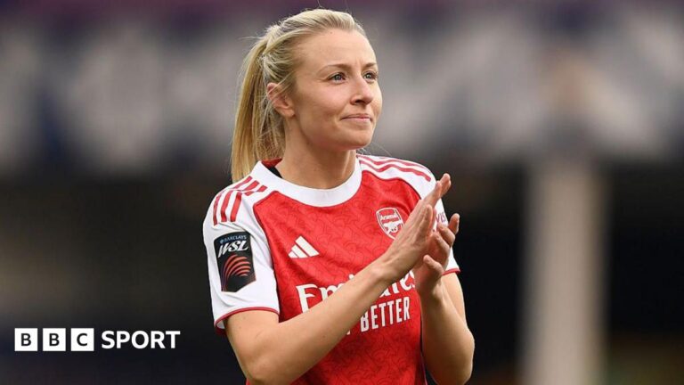 England captain Leah Williamson signs new Arsenal deal Leah Williamson, in a red Arsenal shirt with white sleeves and blonde hair tied back in a ponytail, looks in the direction of the crowd and applauds